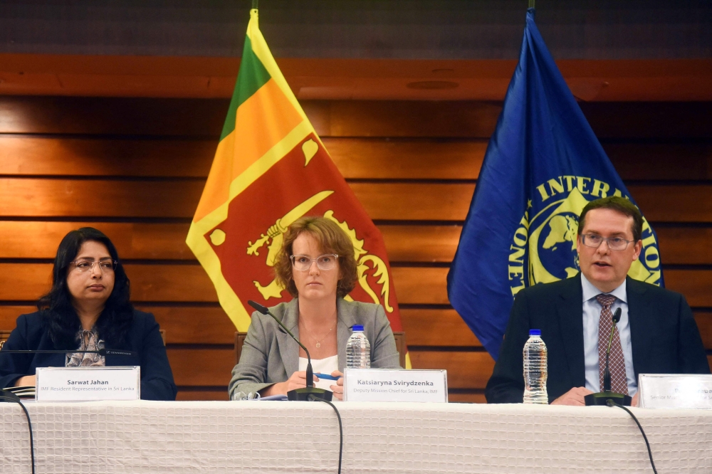 Visiting International Monetary Fund (IMF) team Senior Mission Chief Peter Breuer (R), Deputy Mission Chief Katsiaryna Svirydzenka (C) and IMF and resident representative Sarwath Jahan adrress a press conference in Colombo on September 27, 2023. (Photo by AFP)
