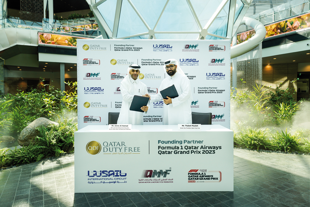 Amro Al Hamad, CEO Lusail International Circuit and Executive Director Qatar Motor and Motorcycle Federation (left) and Thabet Musleh, SVP Qatar Duty Free at the agreement signing.