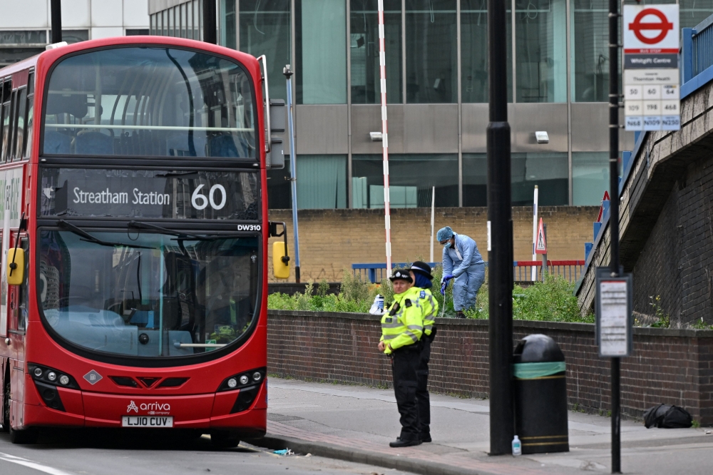 A Police forensic officer works inside a police cordon outside the Whitgift Centre on Wellesley Road in Croydon, south London, on September 28, 2023, following the fatal stabbing of a 15-year-old girl on her way to school on Wednesday. Photo by JUSTIN TALLIS / AFP