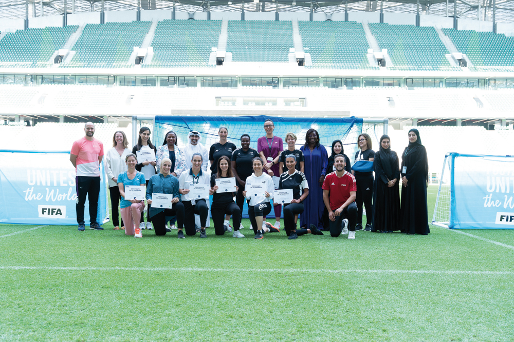 The participants of the FIFA Football for Schools Capacity Building Workshop pose for a photograph with officials.