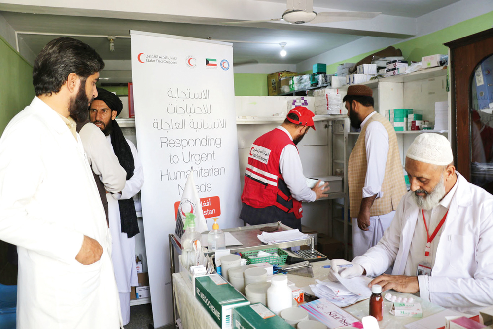 People receive healthcare under a QRCS-KRCS project in Afghanistan.