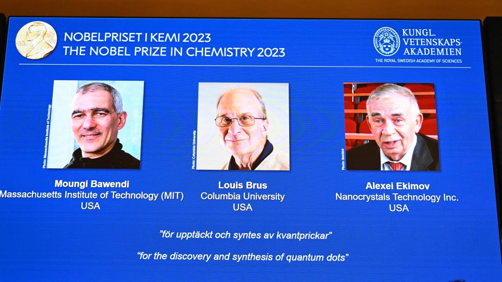 A screen shows this year's laureates US Chemist Moungi Bawendi, US Chemist Louis Brus and Russian physicist Alexei Ekimov during the announcement of the winners of the 2023 Nobel Prize in chemistry on October 4, 2023. (Photo by Jonathan Nackstrand / AFP)