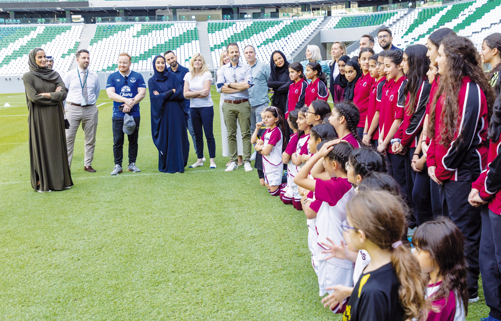 Vice-Chairperson and CEO of Qatar Foundation H E Sheikha Hind bint Hamad Al Thani and other officials with young athletes at the launch of  QF’s partnership with Volkswagen Middle East.