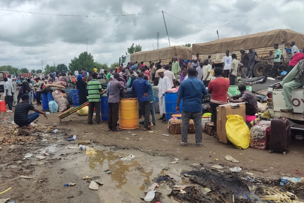Displaced Sudanese wait to cross into Ethiopia from Sudan's border town of Gallabat, on August 3, 2023. (Photo by AFP)