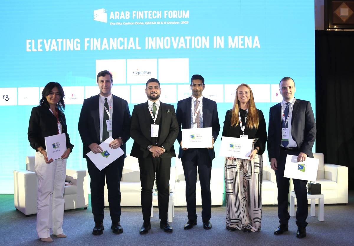 Arab Fintech Forum President Malik Shishtawi along with the speakers at the Ritz-Carlton Doha. 