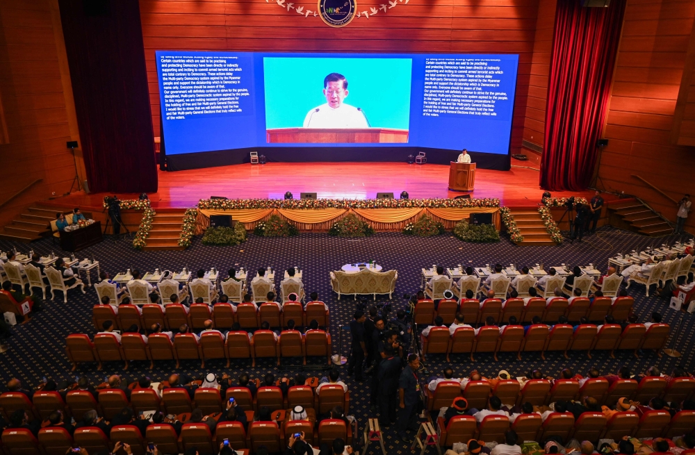 Myanmar's junta chief Min Aung Hlaing delivers a speech during a ceremony to mark the 8th anniversary of the Nationwide Ceasefire Agreement (NCA) in Naypyidaw on October 15, 2023. (Photo by AFP)