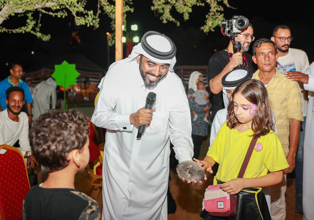 Hamad Al Khulaifi interacting with children during an event organised by the Ministry of Environment and Climate Change at Expo 2023 Doha.