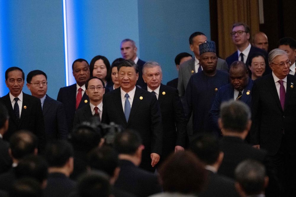 China's President Xi Jinping and other leaders leave after the opening ceremony of the third Belt and Road Forum for International Cooperation at the Great Hall of the People in Beijing on October 18, 2023. (Photo by Pedro PARDO / AFP)