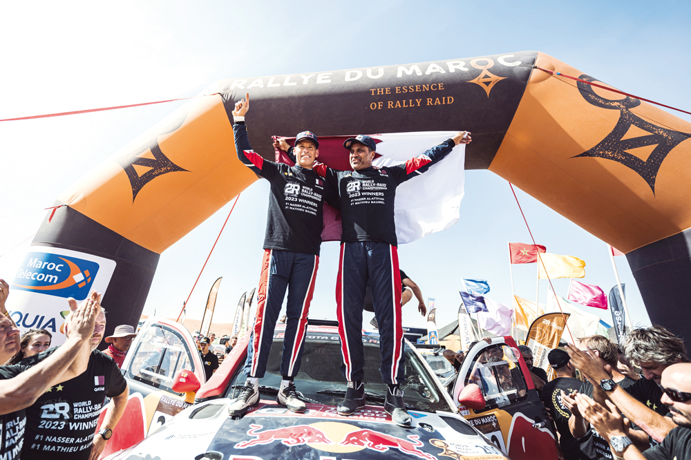 Nasser Al Attiyah and his co-driver Mathieu Baumel celebrate their second successive World Rally Raid Championship (W2RC) title at the finish line of Rallye du Maroc, yesterday. 
