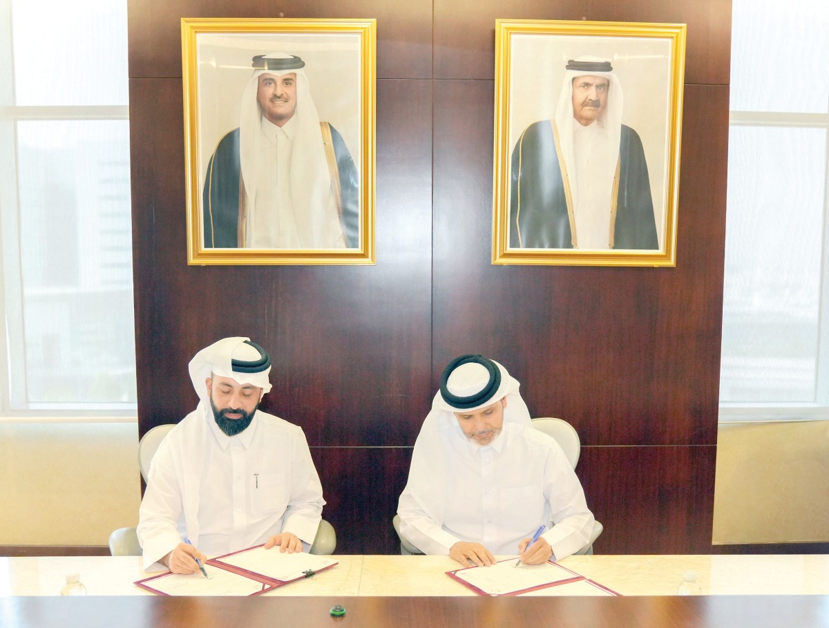 Assistant Minister of Health Affairs at the Ministry of Public Health, Dr. Saleh Ali Al Marri (right) and QRDI Council Secretary-General Eng. Omar Al Ansari signing the agreement. 