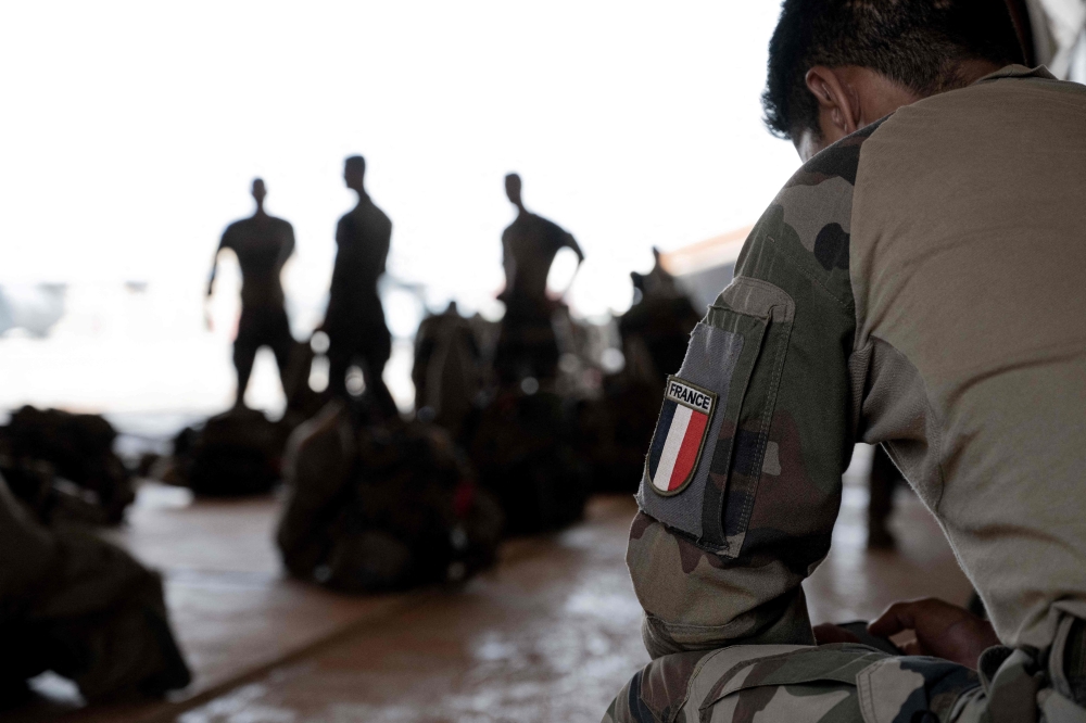 (FILES) French soldiers of the 2e Regiment Etranger de Parachutistes (2eREP - 2nd Foreign Parachute Regiment ) prepare for a mission on the French BAP air base, in Niamey, on May 14, 2023. (Photo by ALAIN JOCARD / AFP)
