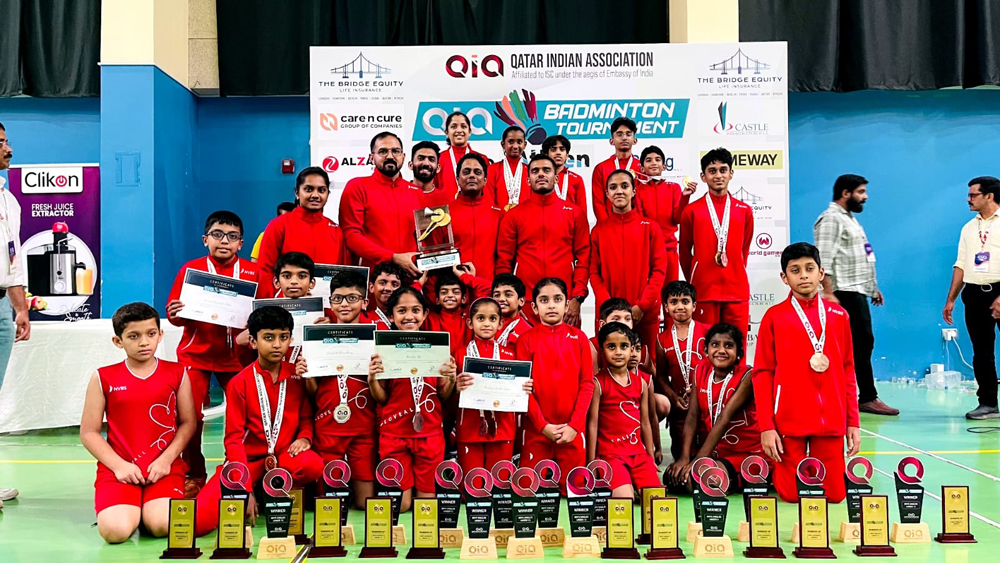 NVBS badminton team pose for a photograph after winning QIA Badminton Tournament.