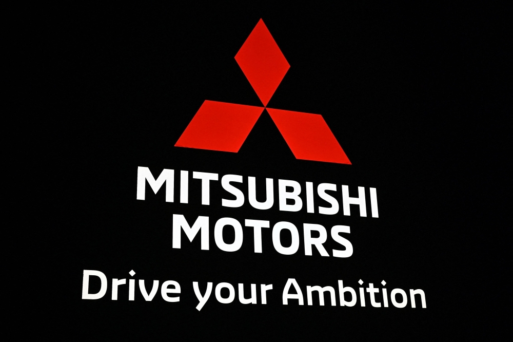 This file picture taken on October 23, 2019 shows the Mitsubishi Motors logo during the Tokyo Motor Show in Tokyo. Photo by Charly TRIBALLEAU / AFP