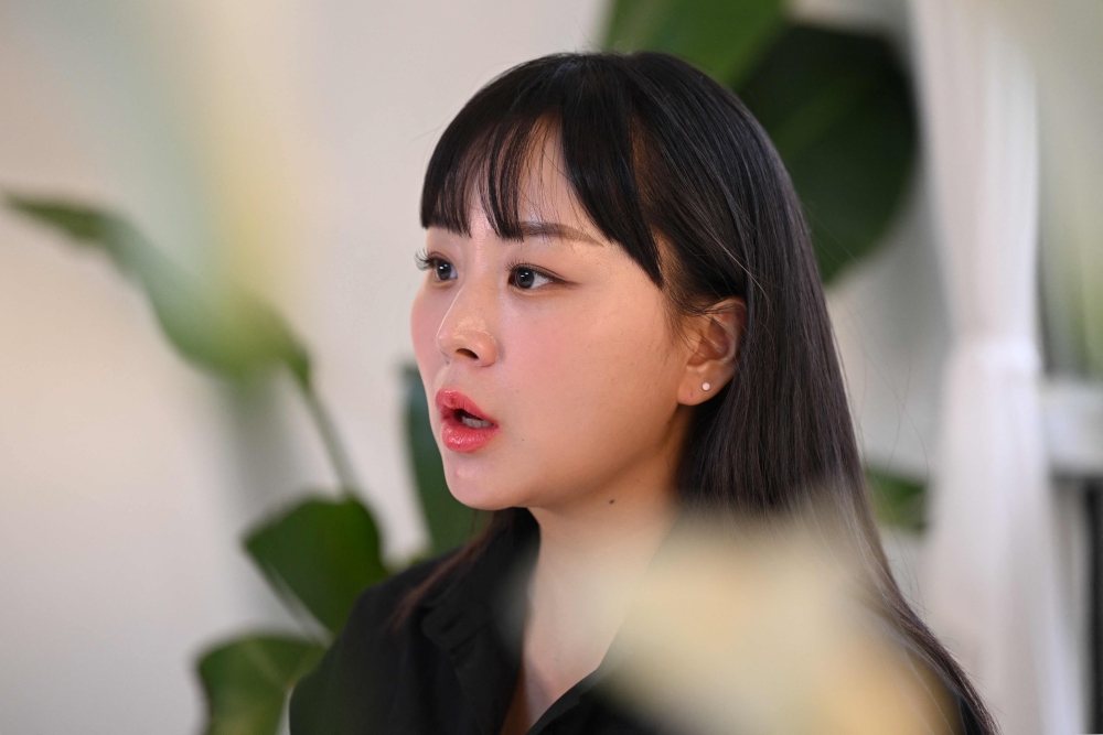 This picture taken on October 26, 2023 shows Itaewon Halloween crush survivor Kim Cho-long speaking during an interview with AFP at a studio in Seoul. Photo by Jung Yeon-je / AFP