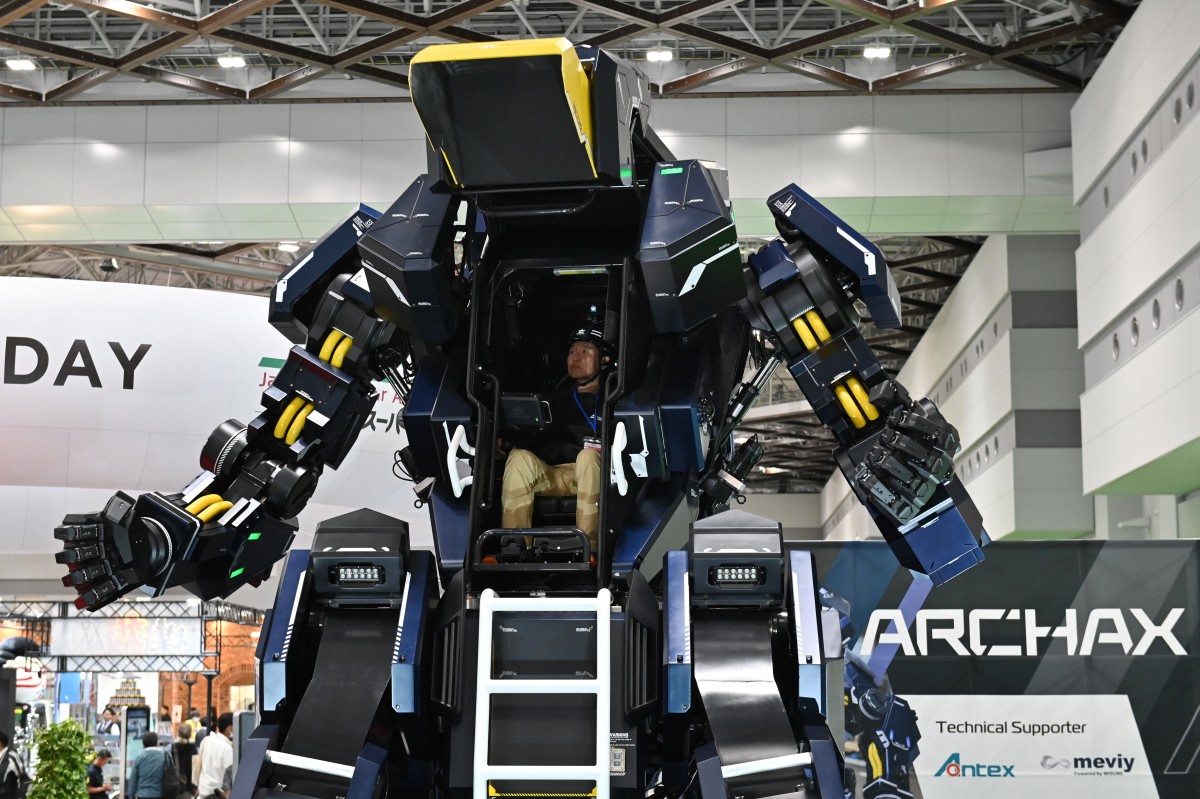 Japanese robotics startup Tsubame Industries exhibit the ARCHAX robot, weighing 3.5 tonnes and measuring 4.5 meters in height, during the press day of the Japan Mobility Show in Tokyo on October 25, 2023. (Photos by Kazuhiro NOGI / AFP)

