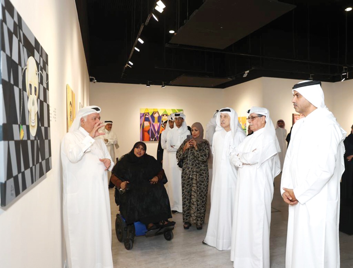 Minister of State and President of the Qatar National Library H E Dr. Hamad bin Abdulaziz Al Kawari (second right) and Saif Saad Al Dosari, Deputy Director-General of Katara and Director of Human Resources (right), along with other artists and officials during the opening of the exhibition.