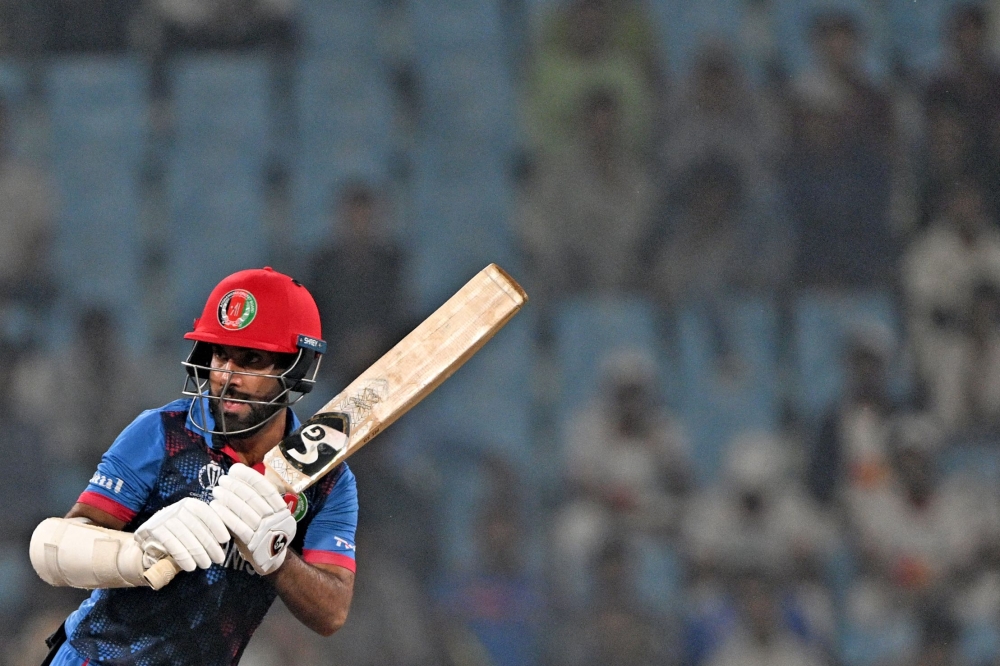 Afghanistan's captain Hashmatullah Shahidi plays a shot during the 2023 ICC Men's Cricket World Cup one-day international (ODI) match between Netherlands and Afghanistan at the Ekana Cricket Stadium in Lucknow on November 3, 2023. (Photo by Arun SANKAR / AFP)