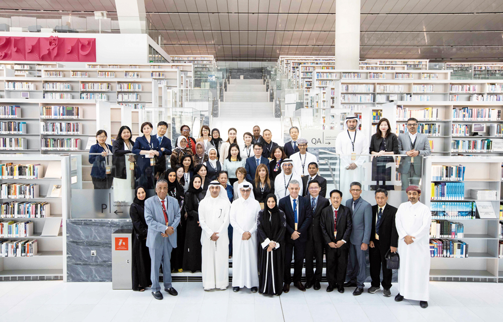 Conference participants with Minister of State and QNL President H E Dr. Hamad bin Abdulaziz Al Kawari.