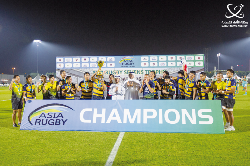 Asia Rugby President Qais Abdulla Al Dhalai and Qatar Rugby and Hockey Committee Chairman Yousef Jaham Al Kuwari with players and officials of Thailand, champions of the 2023 Asia Rugby Sevens Trophy in Doha.
