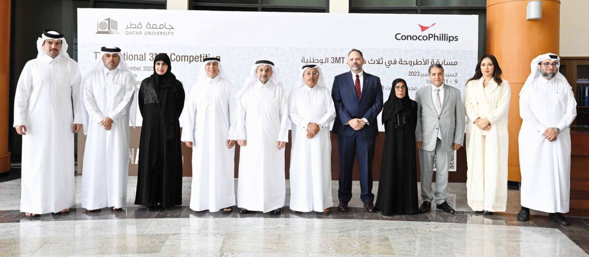 QU President Dr. Omar Al Ansari (fifth left) and other officials at the awards ceremony. 