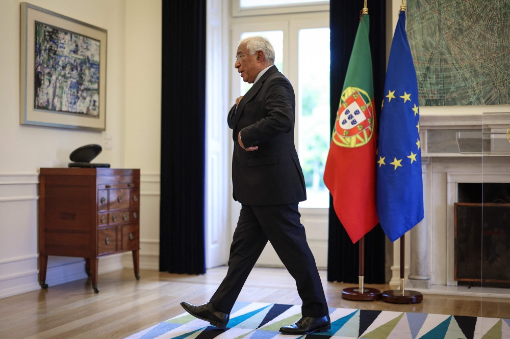 Portuguese Prime Minister Antonio Costa leaves after addressing the nation at Sao Bento Palace in Lisbon on November 7, 2023. Portugal's Prime Minister Antonio Costa announced he would resign as head of state today in the wake of a corruption scandal involving energy contracts.(Photo by PATRICIA DE MELO MOREIRA / AFP)