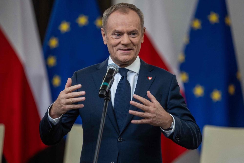 Leader of the Civic Coalition Donald Tusk gives a press statement prior to the signing of the coalition deal, at the Polish parliament in Warsaw on November 10, 2023. (Photo by Wojtek Radwanski / AFP)