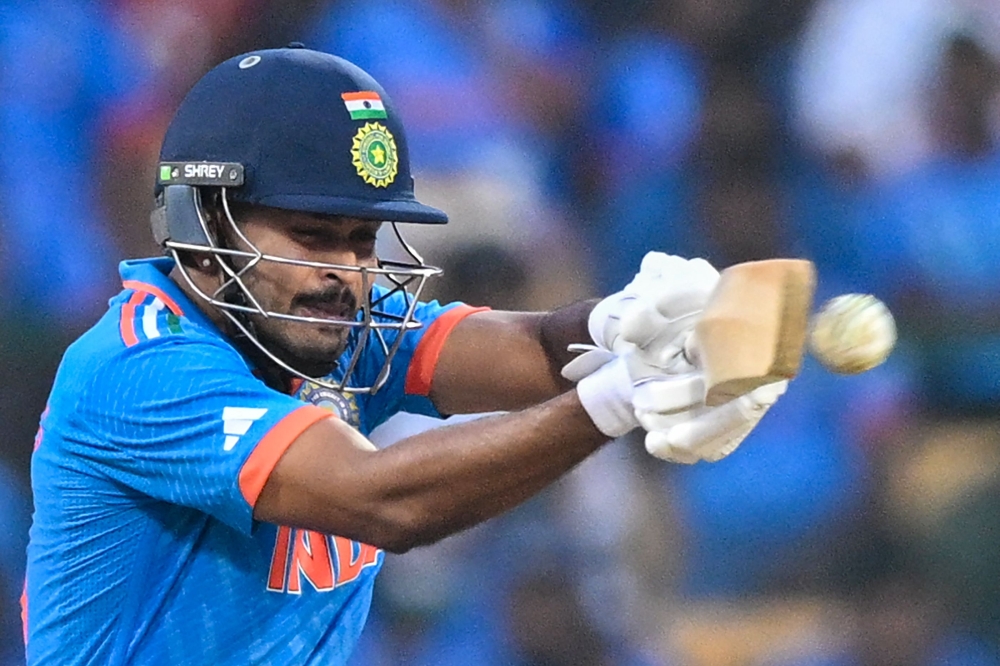 India's Shreyas Iyer plays a shot during the 2023 ICC Men's Cricket World Cup one-day international (ODI) match between India and Netherlands at the M. Chinnaswamy Stadium in Bengaluru on November 12, 2023. (Photo by R.Satish BABU / AFP)