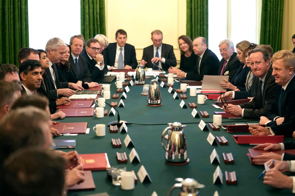 Britain's Prime Minister Rishi Sunak (L) chairs a cabinet meeting with his new cabinet including Britain's Foreign Secretary David Cameron (R) at 10 Downing Street in central London on November 14, 2023 following a reshuffle. (Photo by Kin Cheung / Pool / AFP)