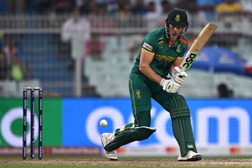 South Africa's David Miller plays a shot during the 2023 ICC Men's Cricket World Cup one-day international (ODI) second semi-final match between Australia and South Africa at the Eden Gardens in Kolkata on November 16, 2023. (Photo by Arun SANKAR / AFP) /