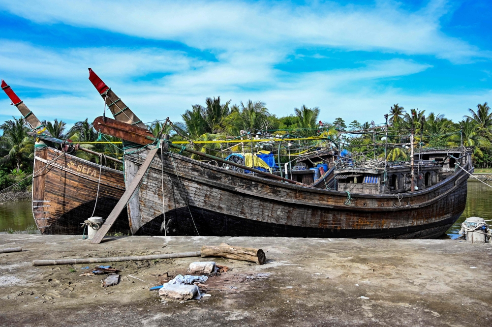 This picture taken on November 18, 2023 in the Batee subdistrict in Aceh Province's Pidie region shows the two boats that carried Rohingya refugees to Batee and Laweung on November 14 and November 15, 2023. (Photo by Chaideer Mahyuddin / AFP)