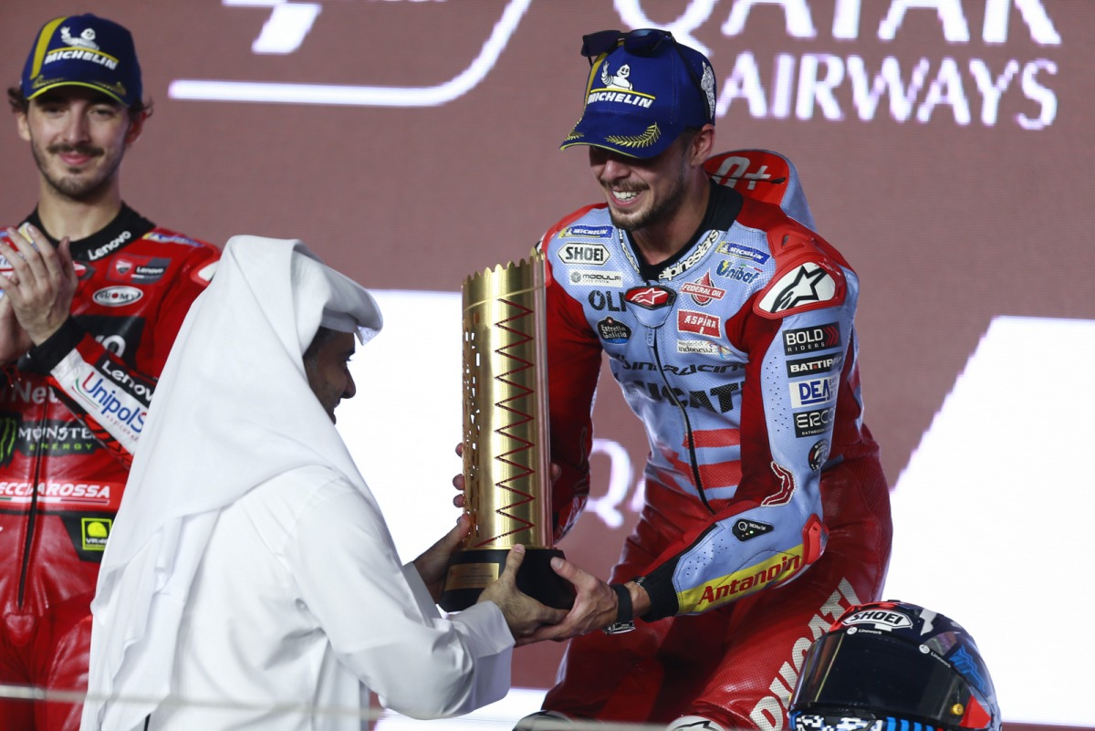 Qatar Airways Group Chief Executive Engr. Badr Mohammed Al Meer presents Gresini Racing’s Fabio Di Giannantonio with the winner's trophy for the MotoGP Qatar Airways Grand Prix of Qatar 2023. Pic: Rajan Vadakkemuriyil / The Peninsula