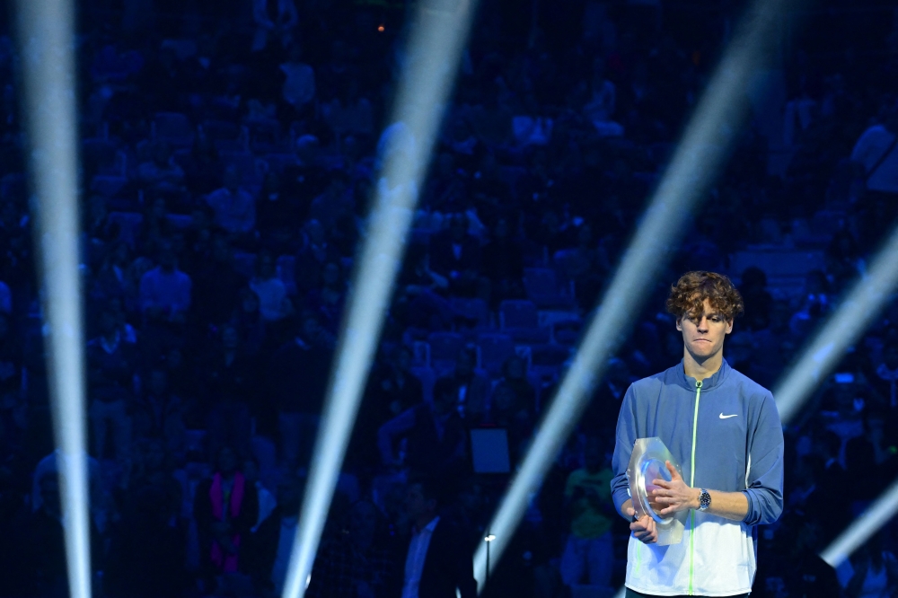 Italy's Jannik Sinner is pictured during the trophy ceremony after being defeated by Serbia's Novak Djokovic during the final match at the ATP Finals tennis tournament in Turin on November 19, 2023. (Photo by Tiziana FABI / AFP)