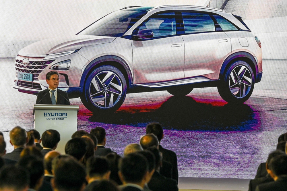 Chang Jae-hoon, president and chief executive officer of Hyundai Motor, speaks at the opening of Hyundai Motor Group’s first smart urban mobility hub in Singapore on November 21, 2023. Photo by Roslan RAHMAN / AFP