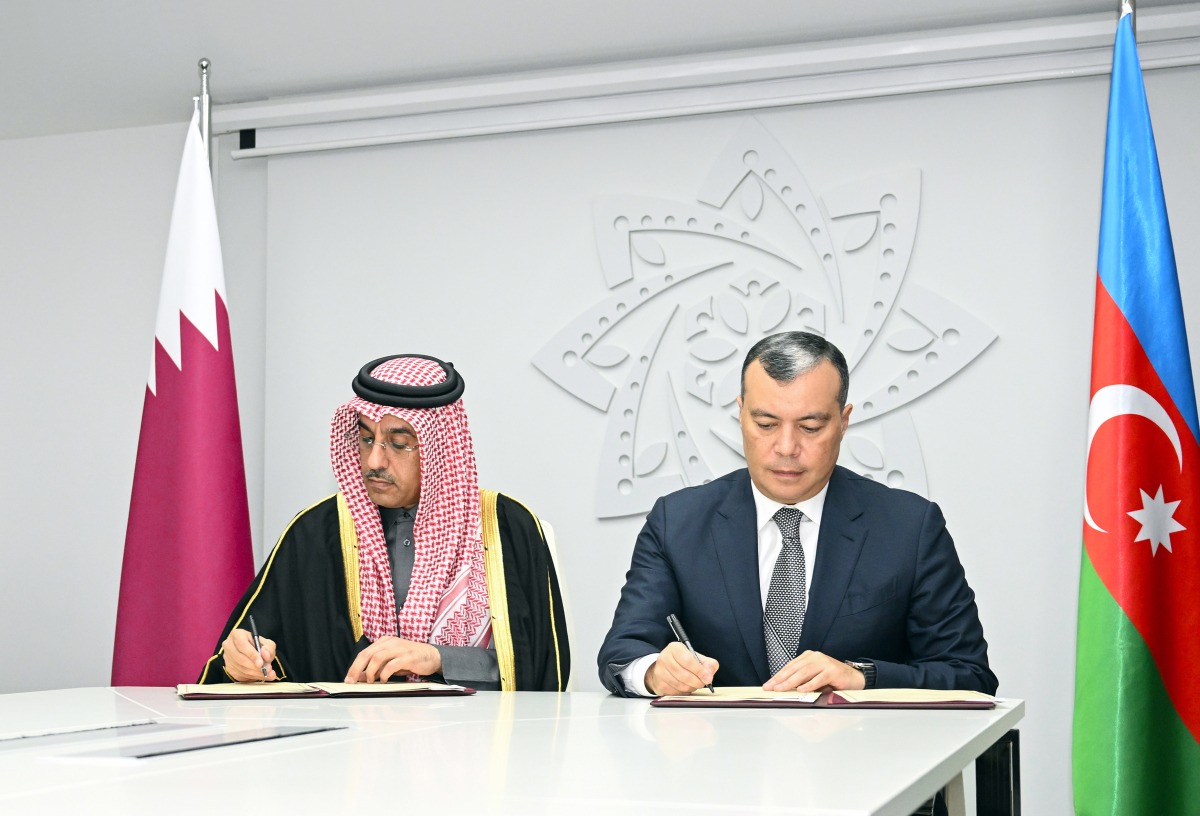 Minister of Labour H E Dr. Ali bin Smaikh Al Marri and Minister of Labour and Social Protection of Azerbaijan H E Sahil Babayev signing the MoU. 