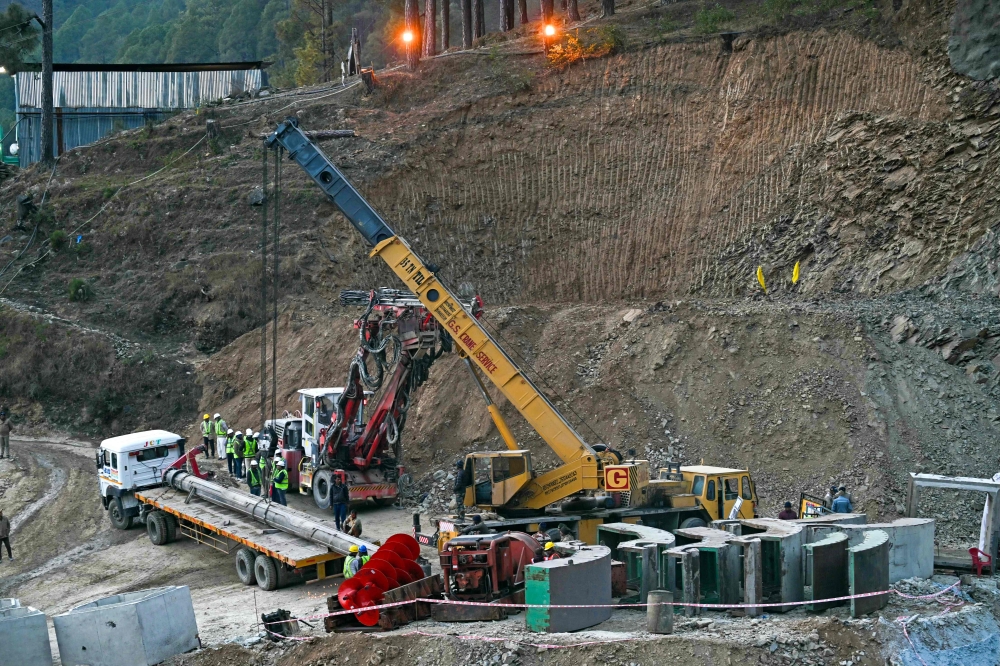 Rescue personnel work at the mouth of the collapsed under construction Silkyara tunnel in the Uttarkashi district of India's Uttarakhand state, on November 25, 2023. Photo by Arun SANKAR / AFP