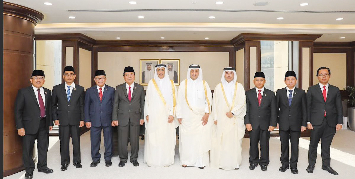 President of the Supreme Judiciary Council and President of the Court of Cassation H E Dr. Hassan bin Lahdan Al Mohannadi (fifth left), Chief Justice of the Supreme Court of Indonesia H E Muhammad Syarifuddin (fourth left), and other officials pose for a group picture in Doha yesterday.
