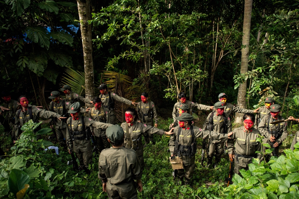 File photo: Guerrillas of the New People's Army (NPA) are seen in formation in the Sierra Madre mountain range, east of Manila, on July 30, 2017. (Photo by Noel Celis / AFP)