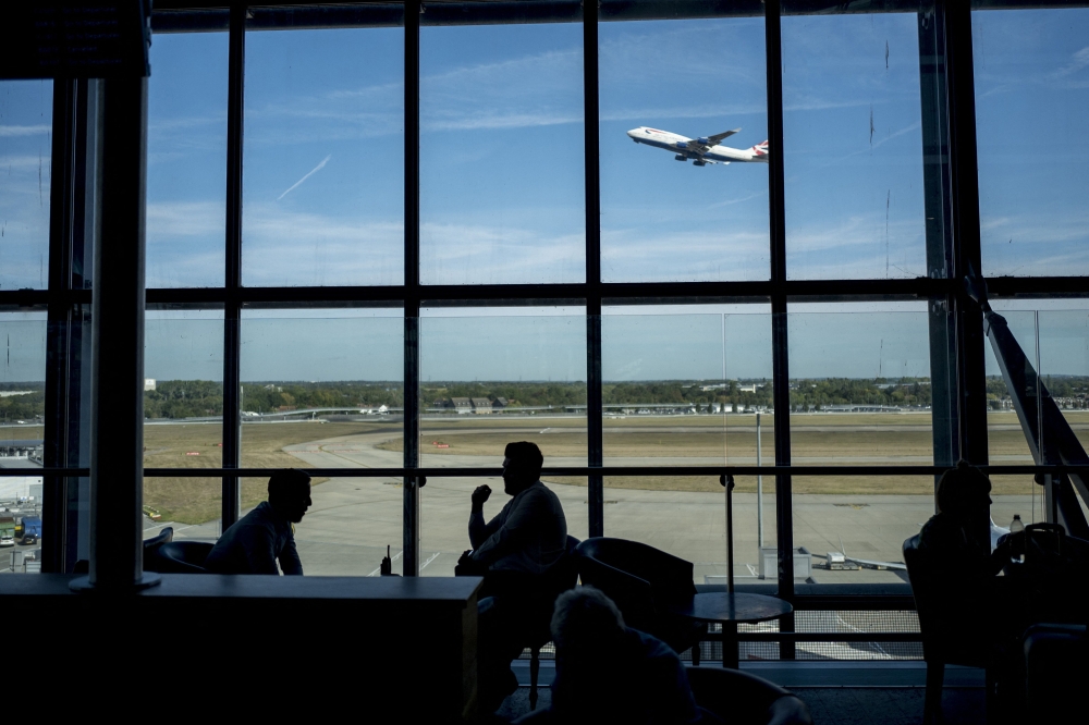 Passengers wait for their flights at Heathrow Airport's Terminal 5 in west London, on September 13, 2019. (Photo by Tolga Akmen / AFP)
