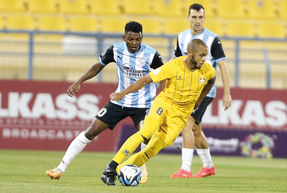 Al Gharafa's Yacine Brahimi controls the ball.
