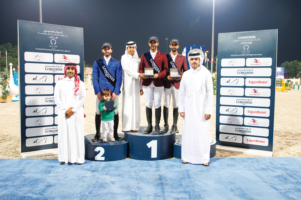 The podium winners of the Big Tour pose for a photograph with officials. 