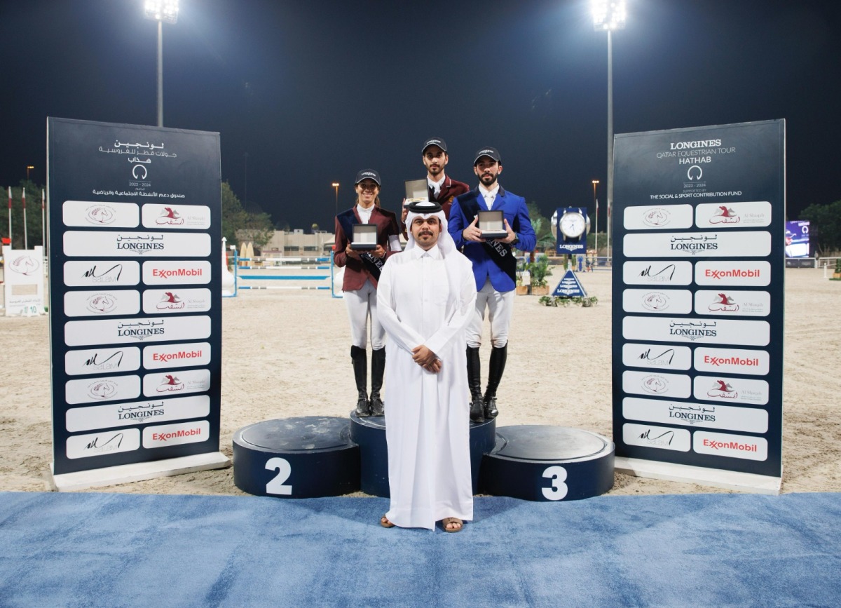 The podium winners of Big Tour pose for a photo with Head of Qatar Equestrian Teams Abdullah Al Marri after the presentation. 
