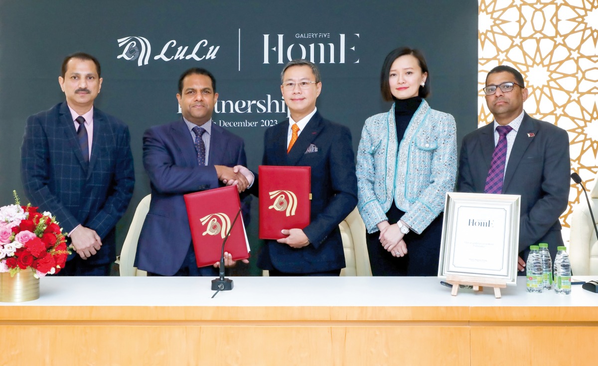 Director of LuLu Group International Dr Mohamed Althaf, Chairman of Gallery Five Group Pegasus Wong pose for group photo with other officials.