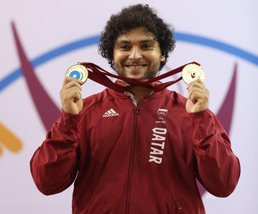 Fares Ibrahim celebrates with his medals.