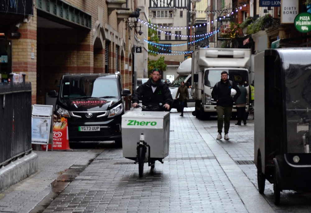 Co-founder of green logistics company Zhero, Joe Sharpe, rides a cargo bike near Sadie Coles HQ gallery in London on October 27, 2023. (Photo by Daniel Matthews / AFP) 