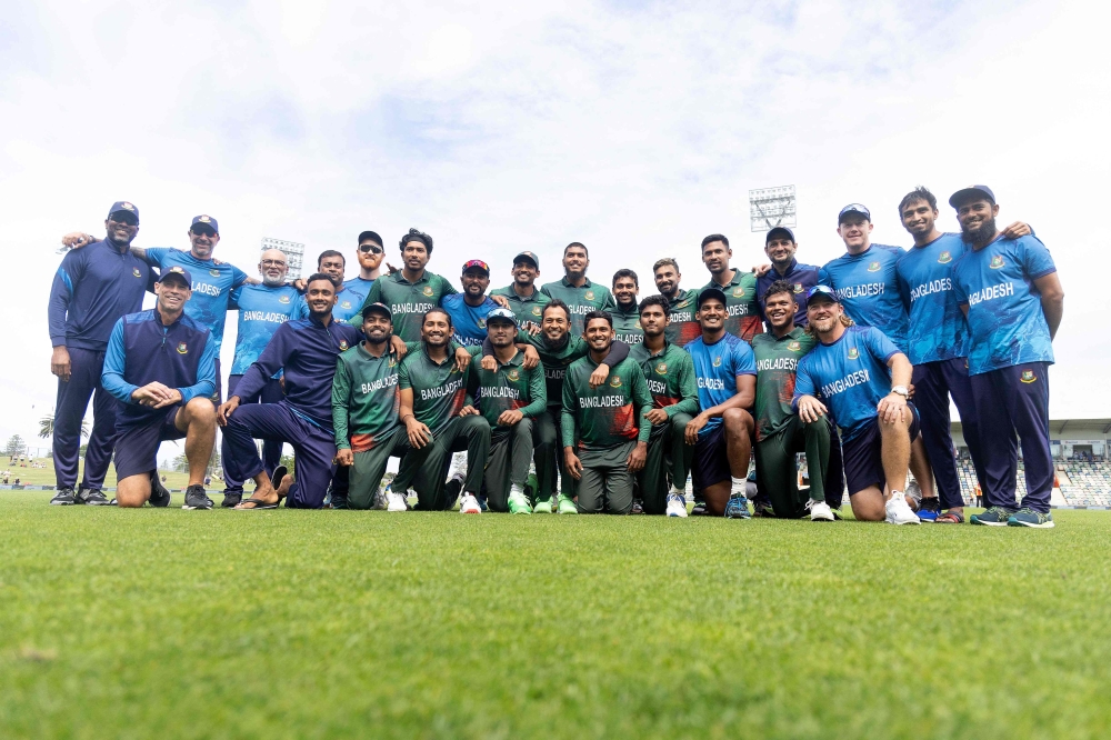 Bangladesh pose for a team photo after their match win during the 3rd ODI cricket match between New Zealand and Bangladesh in Napier on December 23, 2023. (Photo by Marty Melville / AFP)