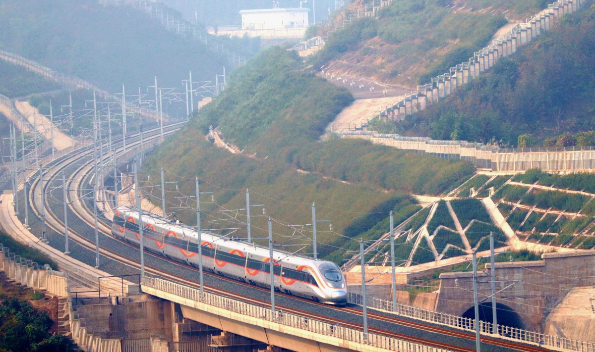 Train G8738, the first train marking the operation of the Chengdu-Zigong-Yibin high-speed railway, is seen running on the railway in southwest China's Sichuan Province, Dec. 26, 2023. Photo by Song Shunzhi/Xinhua
