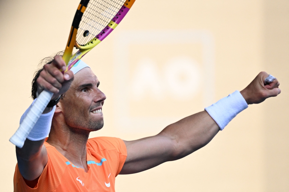 Spain's Rafael Nadal celebrates after winning against Britain's Jack Draper during their men's singles match on day one of the Australian Open tennis tournament in Melbourne on January 16, 2023. Photo by WILLIAM WEST / AFP

