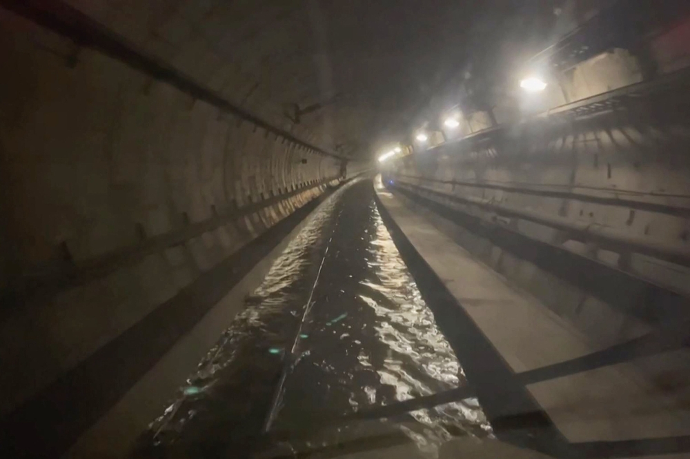 A frame grab taken from a handout video footage posted on the Southeastern Railway's X account on December 30, 2023 shows flooded water in a tunnel used by Eurostar trains, near Ebbsfleet International station in Kent, southern England. (Photo by Handout / Southeastern / ESN / AFP)