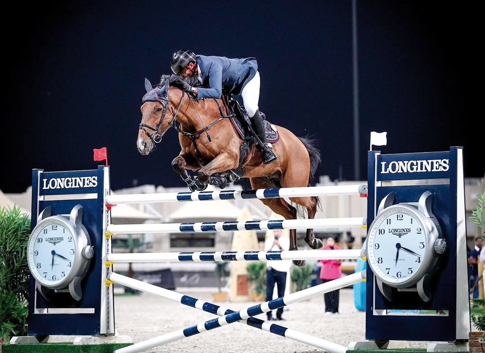 Sheikh Khalifa Al Thani guides Emiro Delle Sementarecce during the Open Class event.  