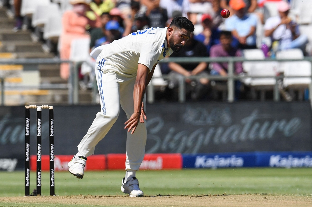 India's Mohammed Siraj delivers a ball during the first day of the second cricket Test match between South Africa and India at Newlands stadium on January 3, 2024. (Photo by Rodger Bosch / AFP)
